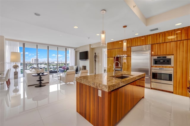 kitchen featuring a sink, modern cabinets, and appliances with stainless steel finishes