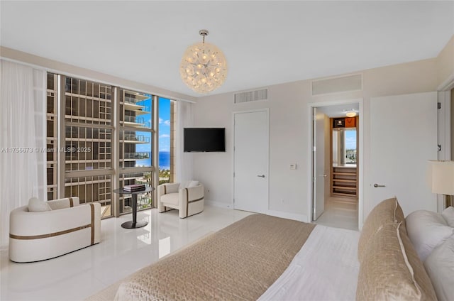 tiled bedroom featuring visible vents and baseboards