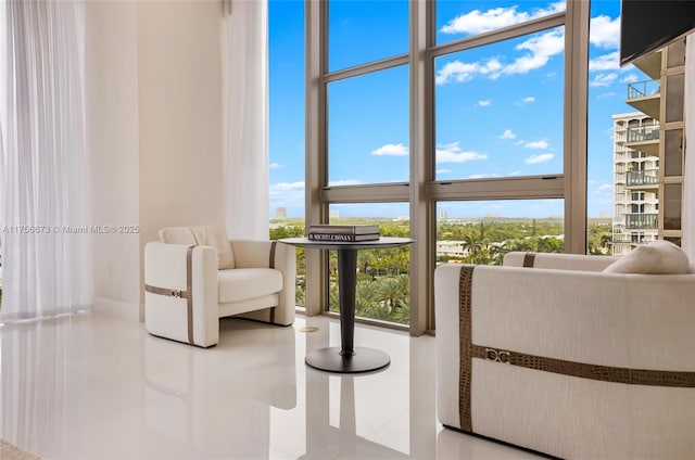 interior space with tile patterned floors and floor to ceiling windows