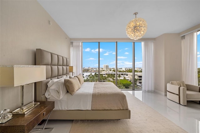 bedroom featuring baseboards and a chandelier