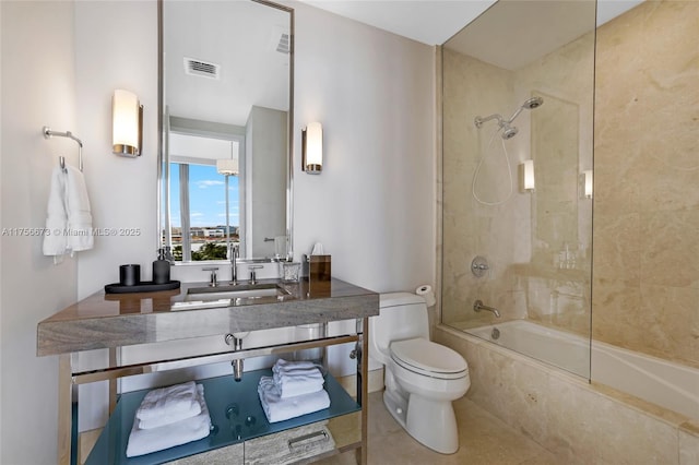 bathroom featuring vanity, visible vents, tile patterned floors, toilet, and shower / bathtub combination