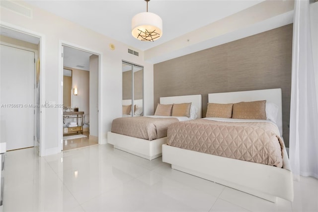 bedroom with visible vents and tile patterned flooring