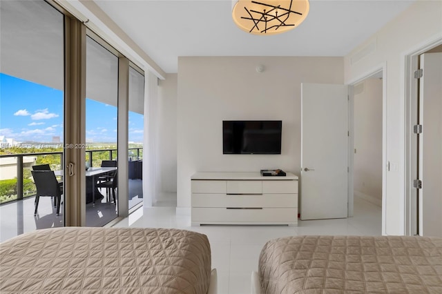 bedroom with visible vents, light tile patterned flooring, and access to outside