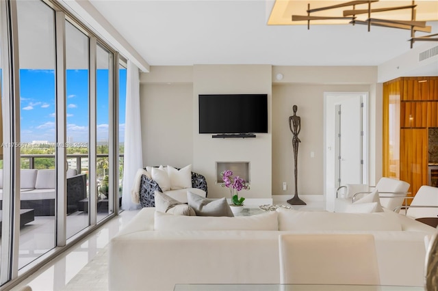 living room with visible vents and expansive windows