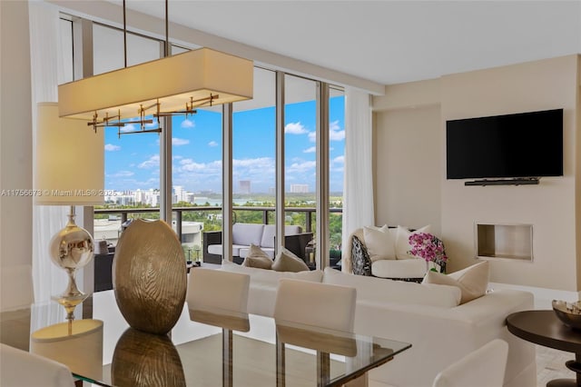 living room featuring expansive windows and a fireplace