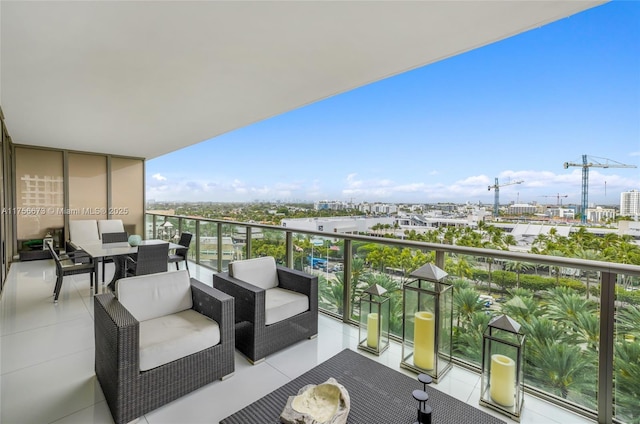 balcony featuring an outdoor living space and a view of city