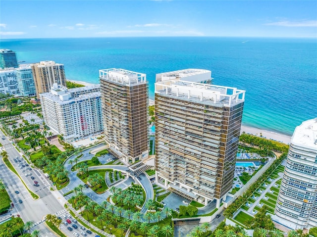 drone / aerial view featuring a view of city and a water view