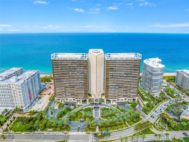 birds eye view of property featuring a city view and a water view