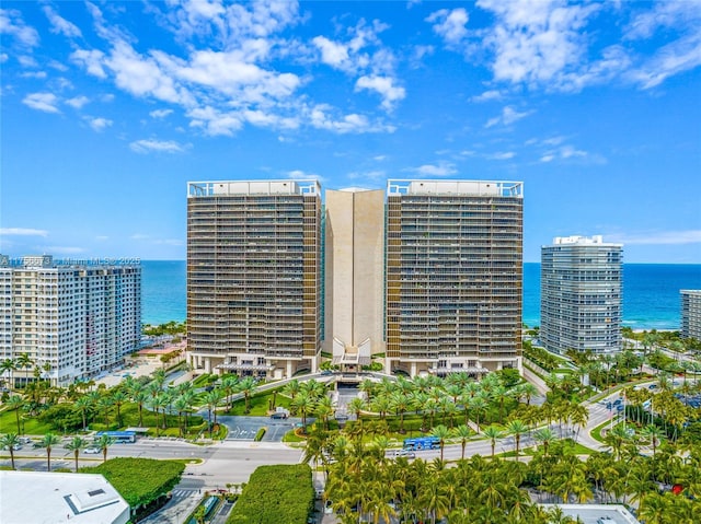 view of building exterior with a city view and a water view