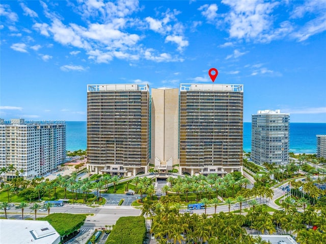 view of property with a city view and a water view