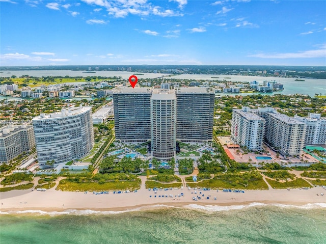 bird's eye view with a city view, a beach view, and a water view