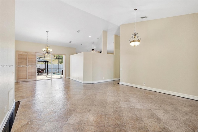 unfurnished room with a notable chandelier, visible vents, a high ceiling, and baseboards