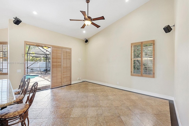 unfurnished room featuring recessed lighting, a ceiling fan, baseboards, and high vaulted ceiling