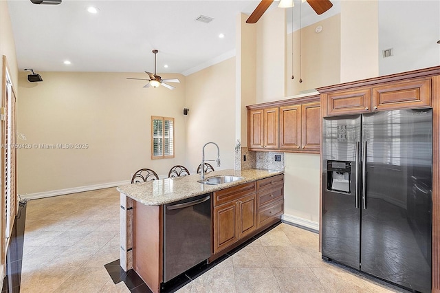 kitchen with visible vents, a peninsula, a sink, dishwasher, and refrigerator with ice dispenser