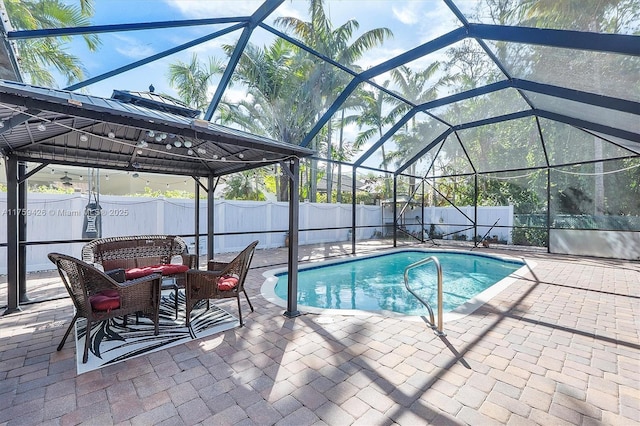 view of pool with a fenced in pool, a lanai, outdoor lounge area, a fenced backyard, and a patio area