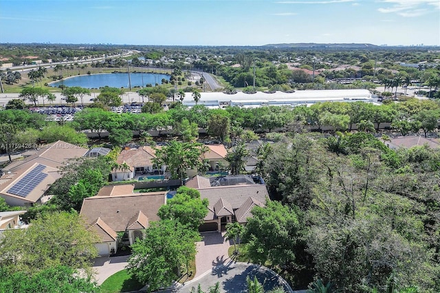 birds eye view of property with a water view and a residential view