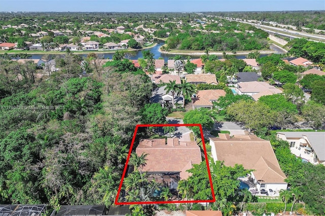 5523 NW 57th Ter, Coral Springs, FL 33067 - aerial perspective of suburban area featuring property boundaries highlighted and a large body of water