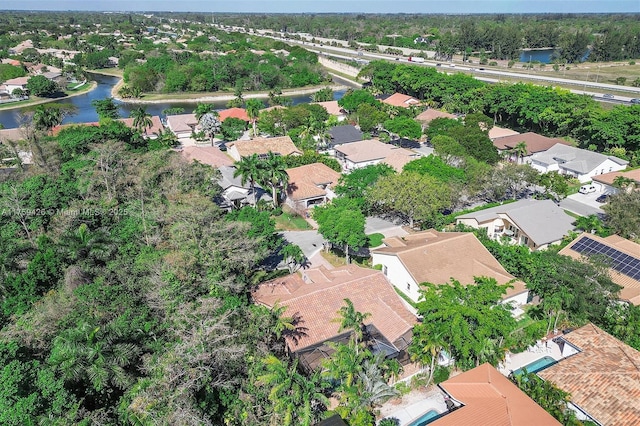 bird's eye view with a residential view and a water view