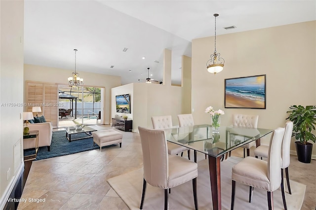 dining area featuring visible vents, a chandelier, and high vaulted ceiling