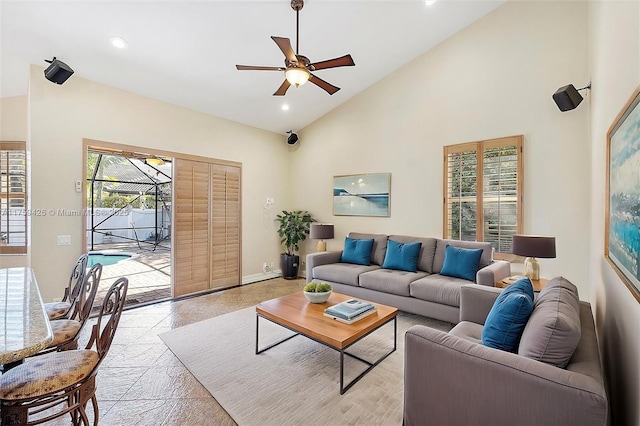 living area featuring recessed lighting, baseboards, high vaulted ceiling, and ceiling fan