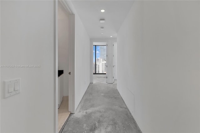 corridor featuring concrete flooring