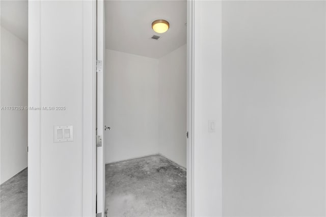 interior space with visible vents and unfinished concrete flooring