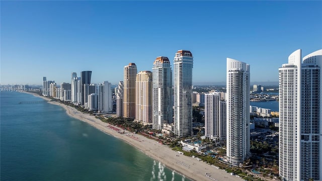 city view featuring a view of the beach and a water view