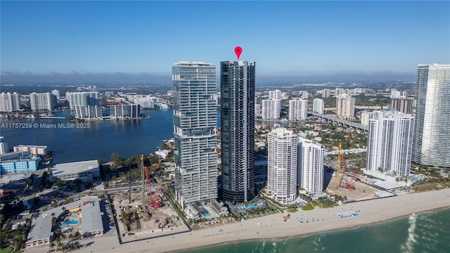 exterior space featuring a water view and a beach view