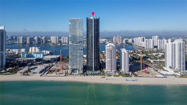 city view featuring a view of the beach and a water view