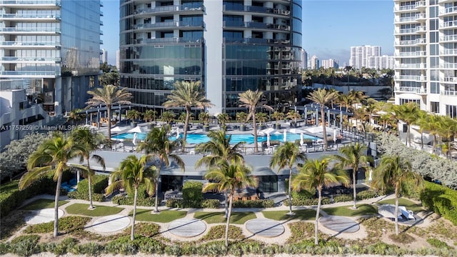 view of property featuring a view of city and a community pool