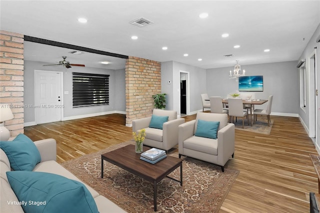 living area with visible vents, recessed lighting, light wood-style floors, and baseboards