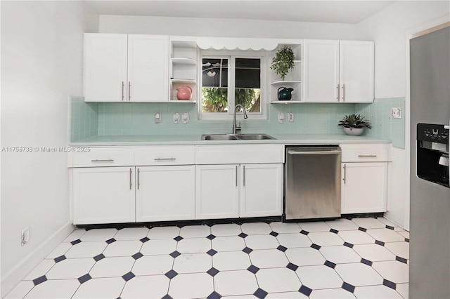 kitchen featuring open shelves, stainless steel appliances, light countertops, and a sink