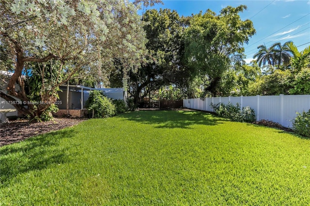 view of yard with a fenced backyard