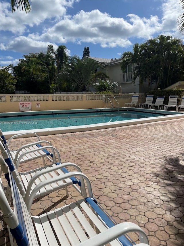 pool featuring a patio area