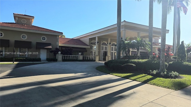 view of property with concrete driveway