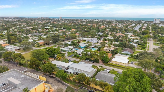 drone / aerial view with a residential view and a water view