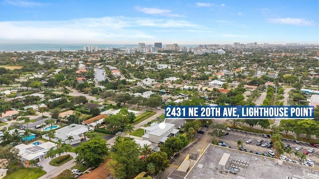 birds eye view of property featuring a city view