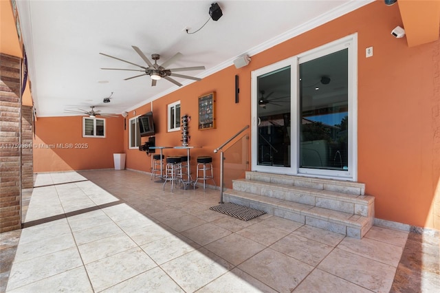 view of patio featuring a ceiling fan and entry steps