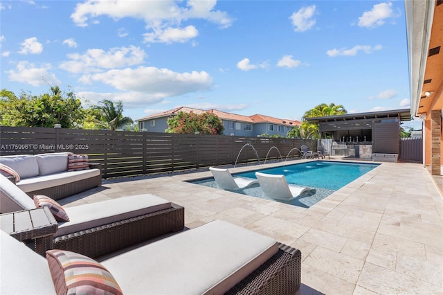 view of pool featuring a patio area, an outdoor living space, a fenced backyard, and a fenced in pool