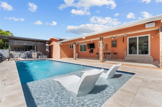 pool with a patio and entry steps