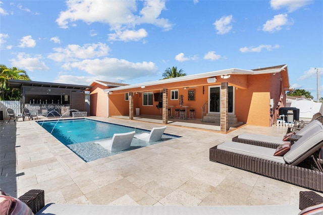 outdoor pool with entry steps, a patio, and fence