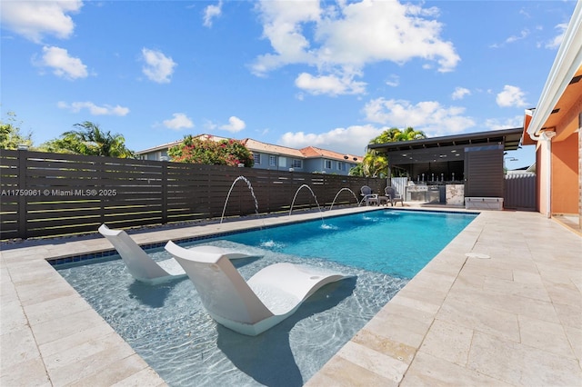 view of swimming pool featuring a fenced in pool, a patio, and a fenced backyard