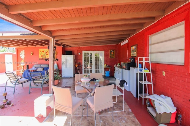 view of patio featuring outdoor dining space and french doors