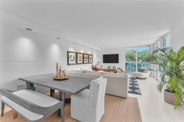 dining area with a wall of windows