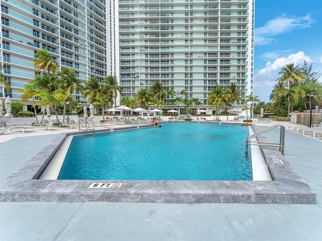 community pool featuring a patio area