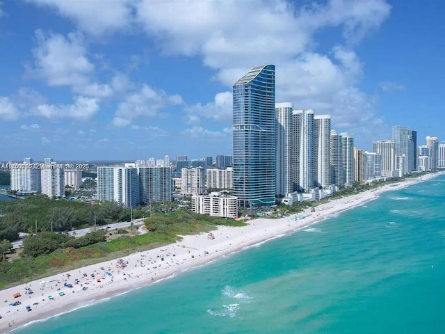 bird's eye view with a view of city, a water view, and a view of the beach