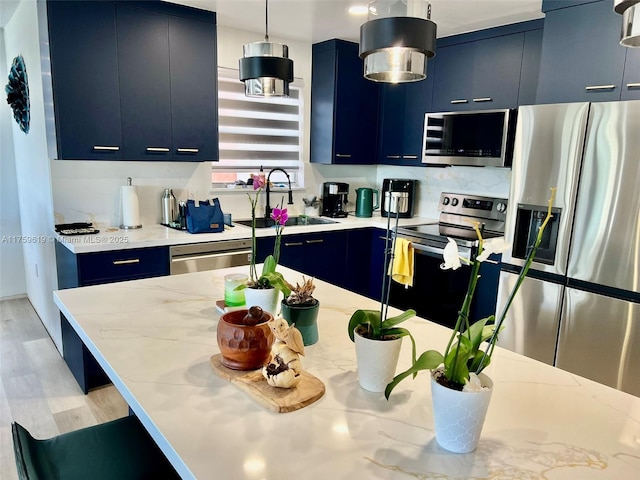 1351 NE Miami Gardens Dr Unit 325E, Miami, FL 33179 - kitchen featuring blue cabinetry, appliances with stainless steel finishes, and a sink