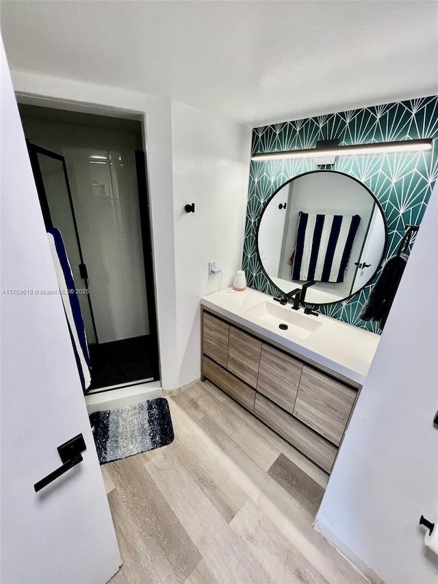1351 NE Miami Gardens Dr Unit 325E, Miami, FL 33179 - full bathroom with a stall shower, wood finished floors, and vanity