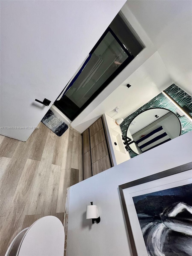 1351 NE Miami Gardens Dr Unit 325E, Miami, FL 33179 - bathroom featuring toilet and wood finished floors