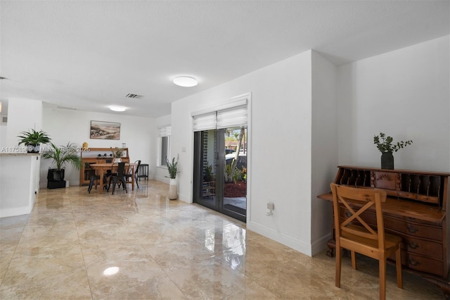 interior space featuring visible vents and baseboards